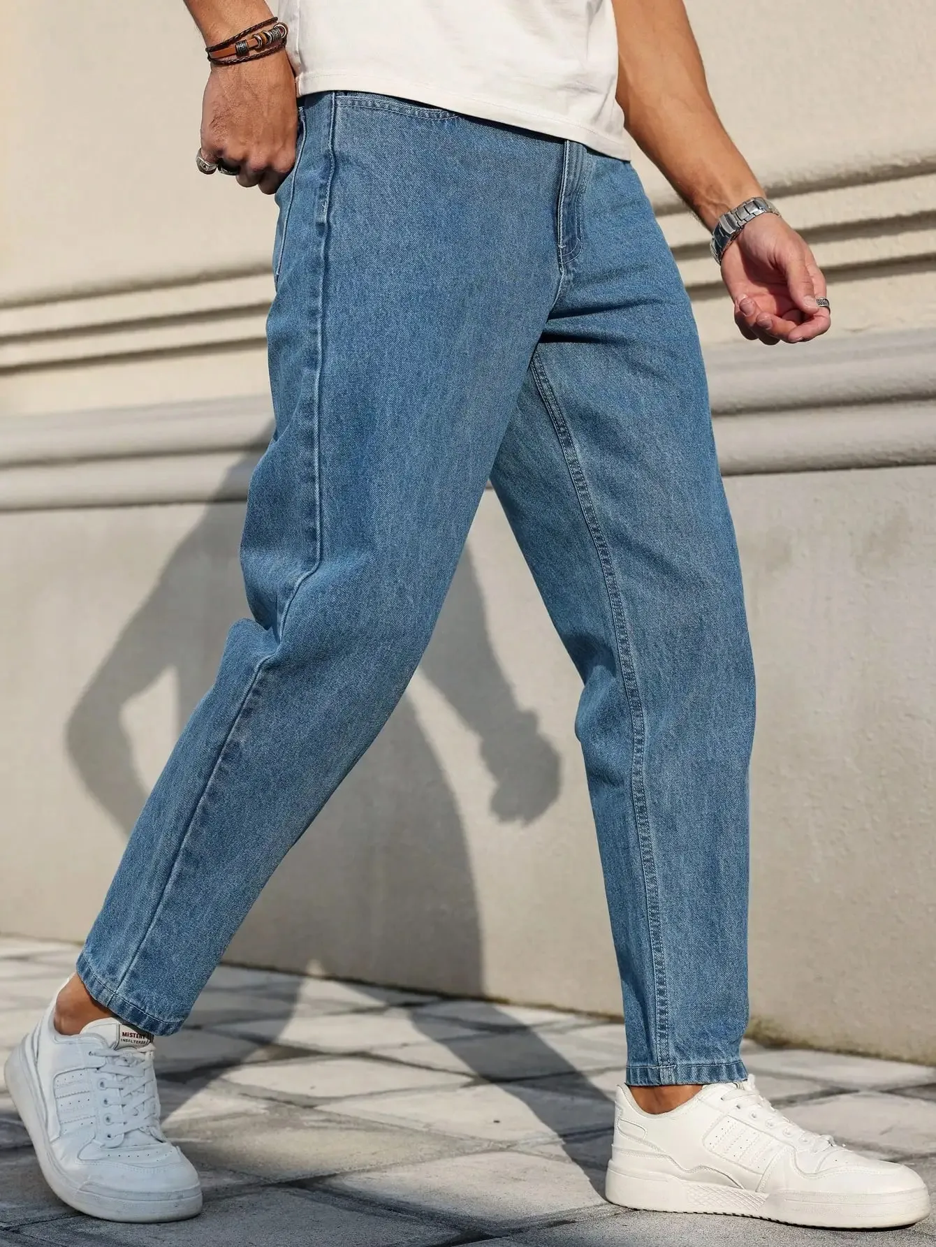 Men's Jeans Are Made of Classic Blue Denim Fabric with a Loose Fit Making Them an Indispensable Versatile Item in the Wardrobe. — image 2